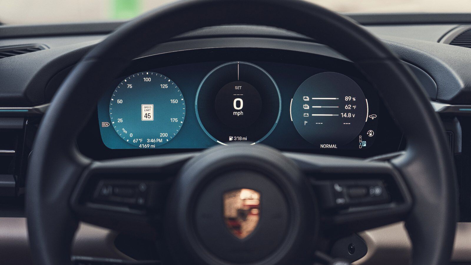 Close-up of the Porsche Macan Electric curved digital instrument cluster