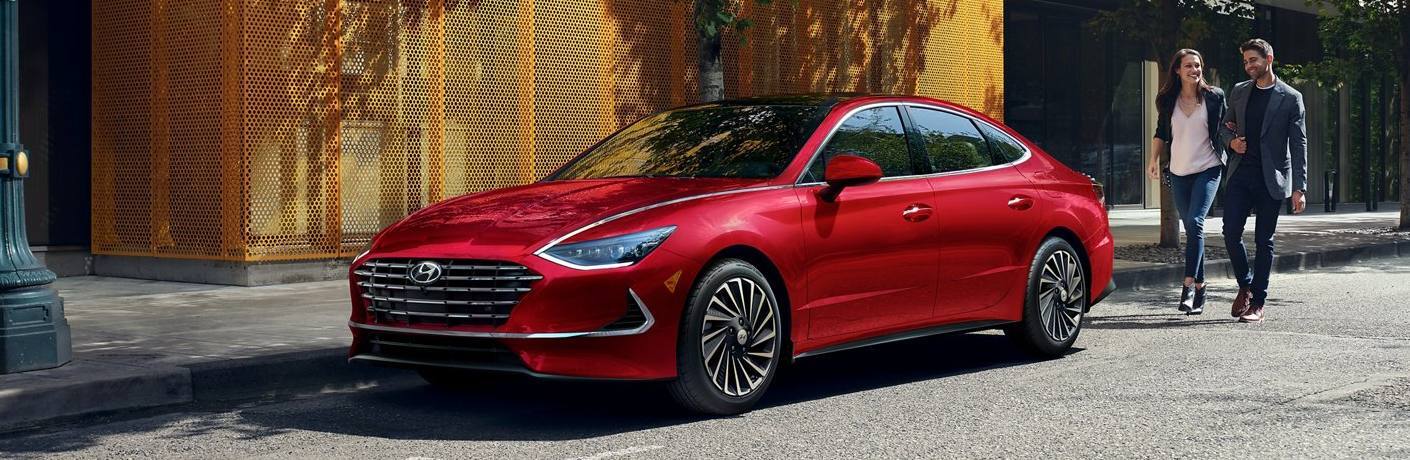 Front driver angle of a red 2021 Hyundai Sonata Hybrid