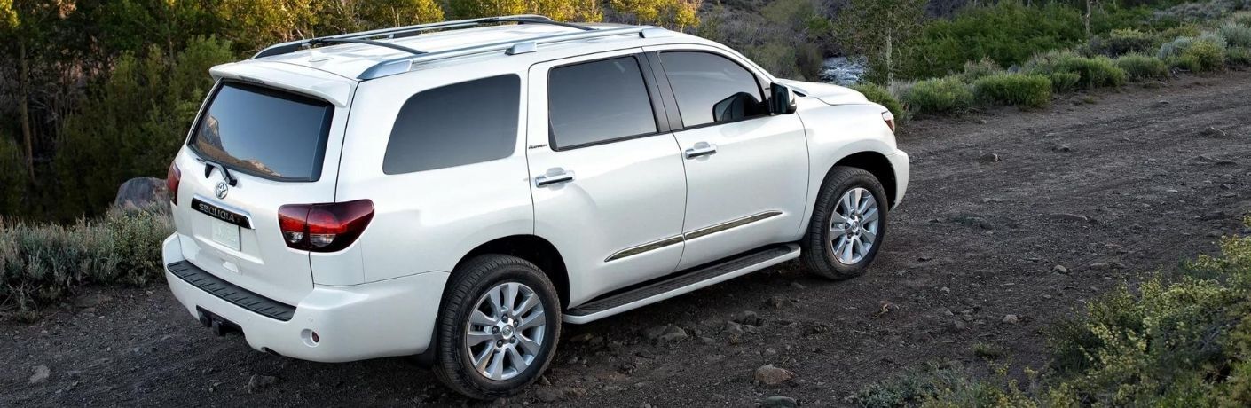 2022 Toyota Sequoia gray side view in front of mountains