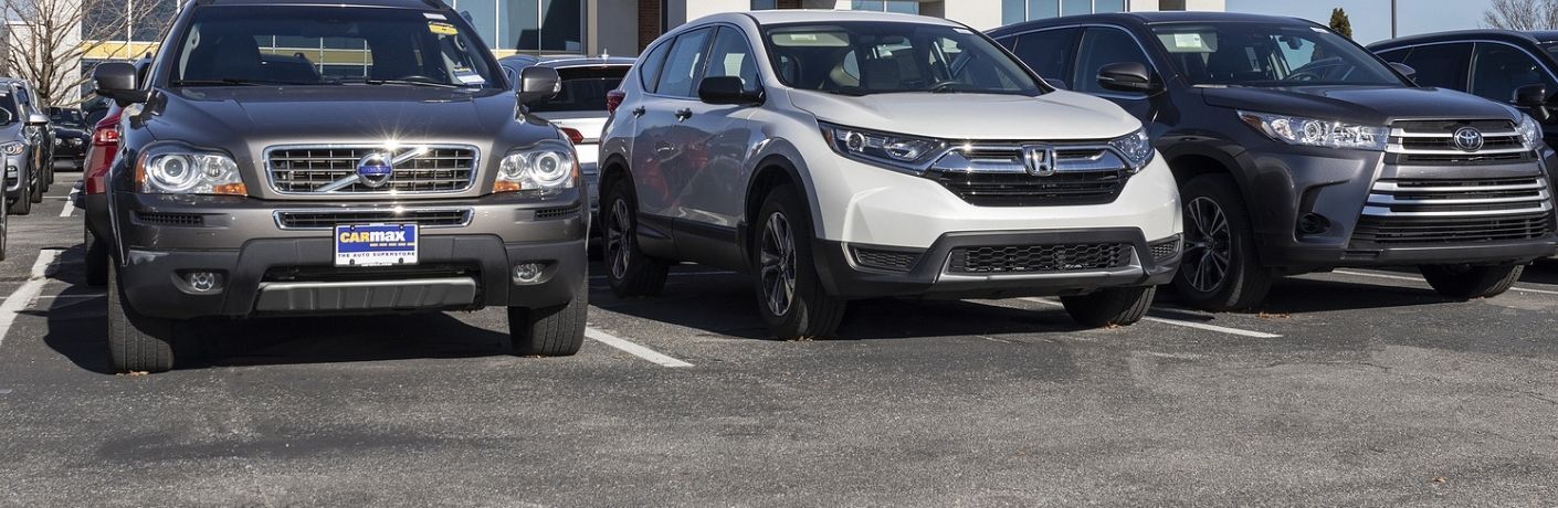 front view of used SUVs parked at a dealership