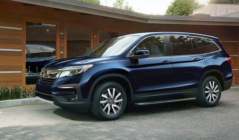 blue Honda Pilot side view