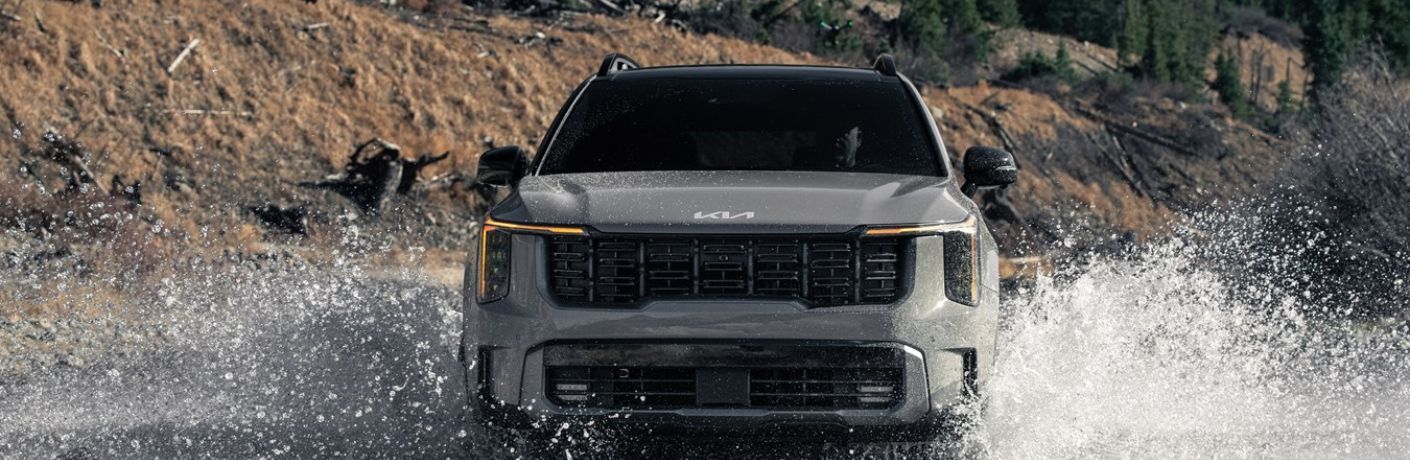 A 2024 Kia Sorento splashing through water
