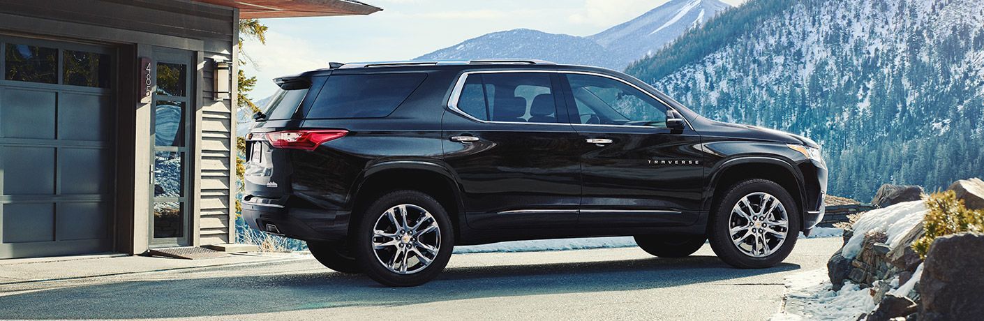 Chevy Traverse in front of snowy mountains