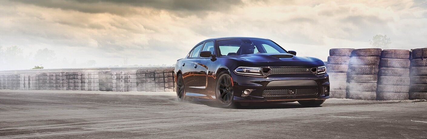 2020 Dodge Charger with tires in the background