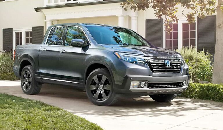 silver Honda Ridgeline in a driveway