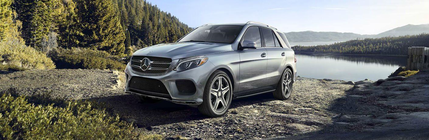 Mercedes-Benz parked by a lake