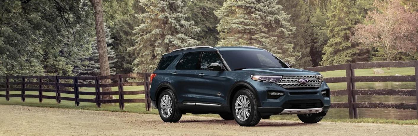 Front-quarter view of the 2024 Ford Explorer XLT  parked near forest