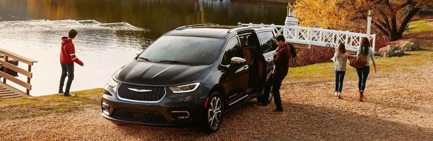 Chrysler minivan near a lake