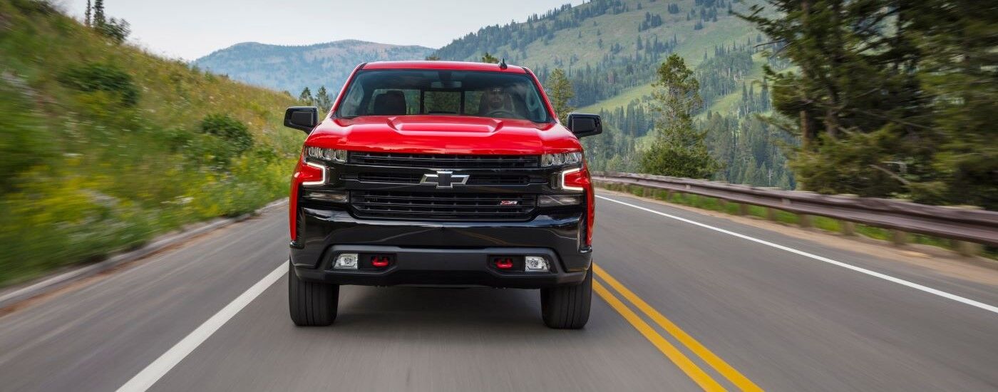 Red 2020 Chevy Silverado 1500 Trailboss driving on a highway