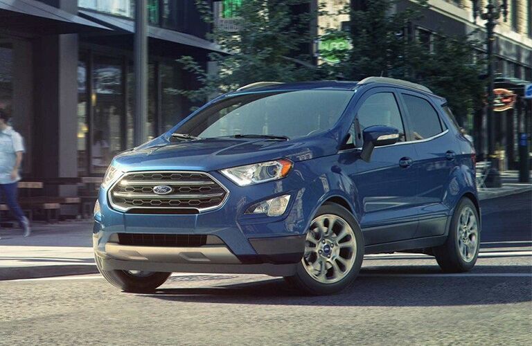 Front view of blue 2019 Ford EcoSport driving through city