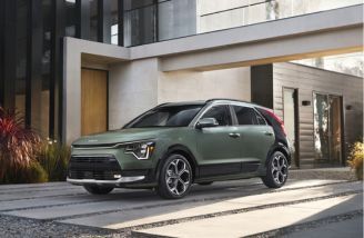 2025 Kia Niro Hybrid parked in front of a house