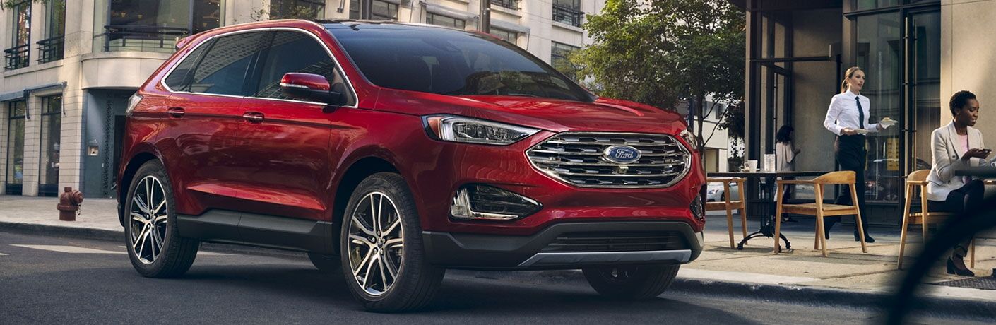 Red 2020 Ford Edge Titanium parked on city street