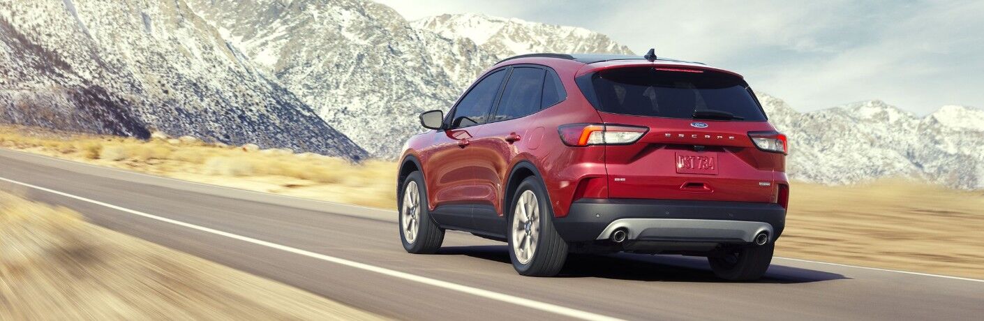 Red 2020 Ford Escape driving on mountainous road