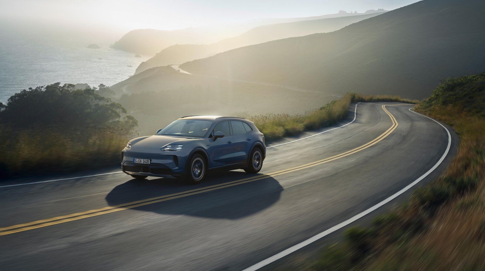 Porsche Cayenne holding a flat line through coastal curves with PDCC – Champion Porsche Pompano Beach, FL