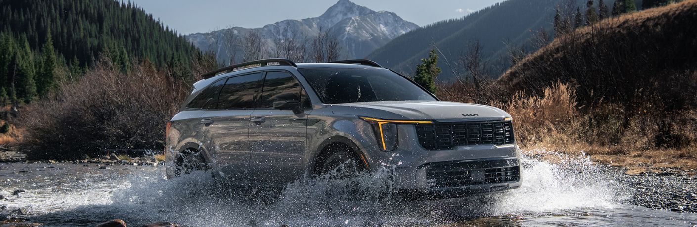 diagonal front view image of the 2025 Kia Sorento X-Pro on a watery terrain