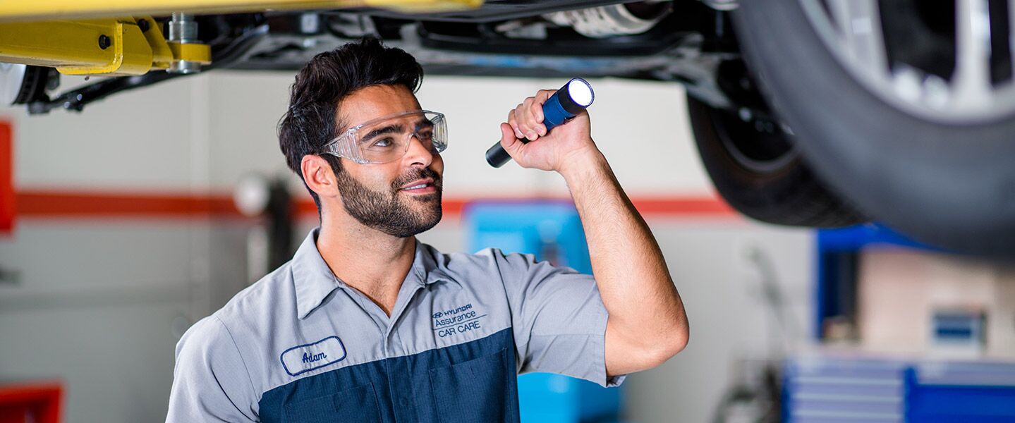service technician talking to customer in service department