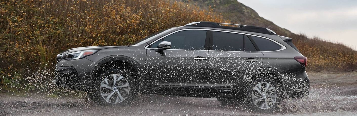 2020 Subaru Outback parked on mud and water