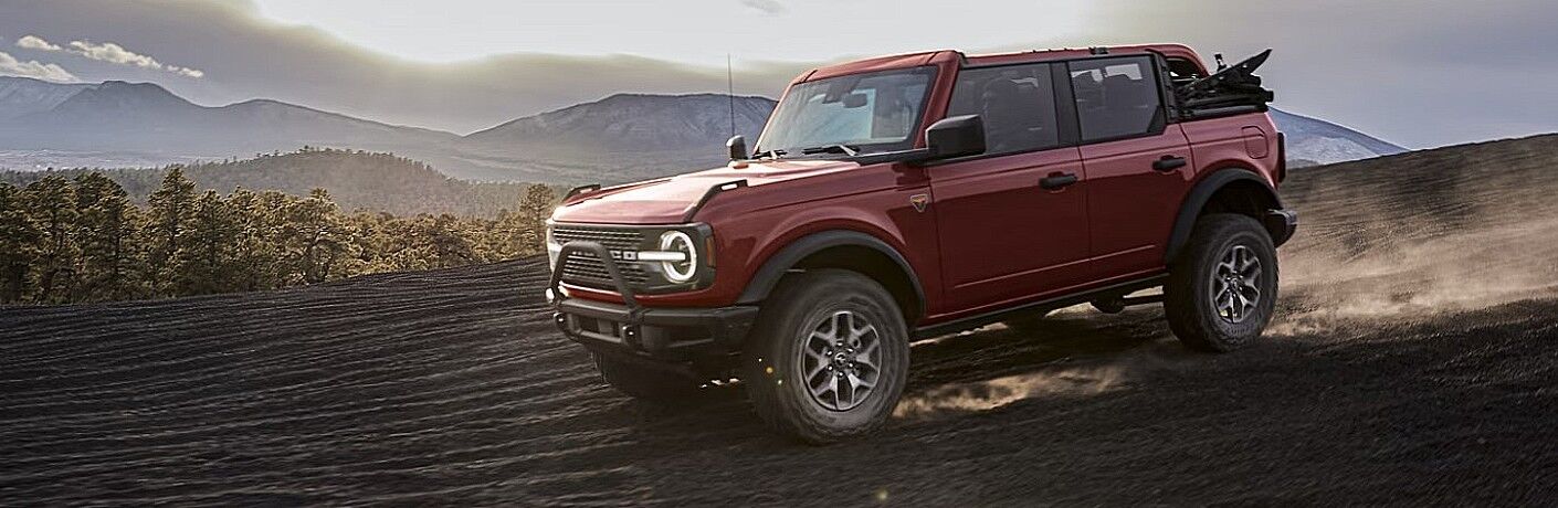 2024 Ford Bronco in red driving on the road