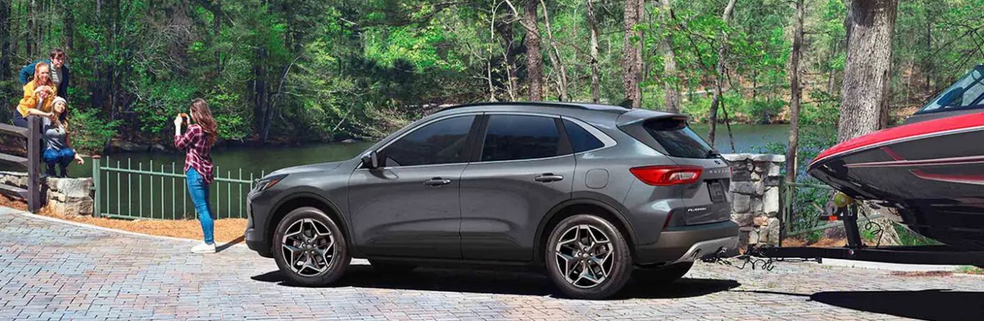 2026 Ford Escape Platinum side view towing a boat
