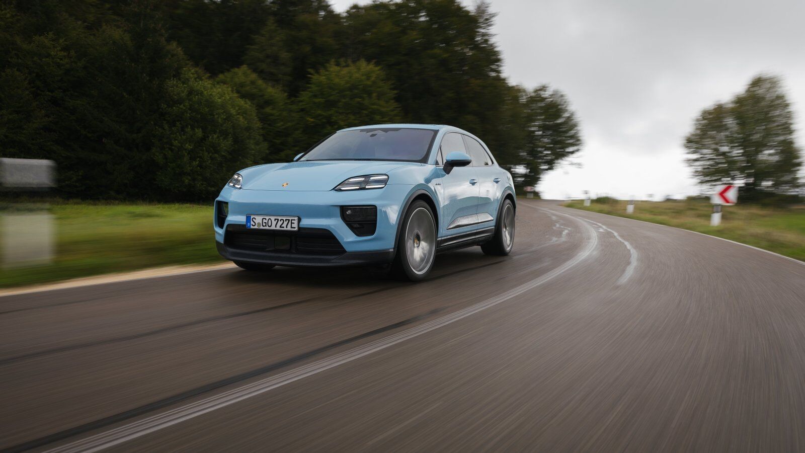 Porsche Macan Electric driving on a highway