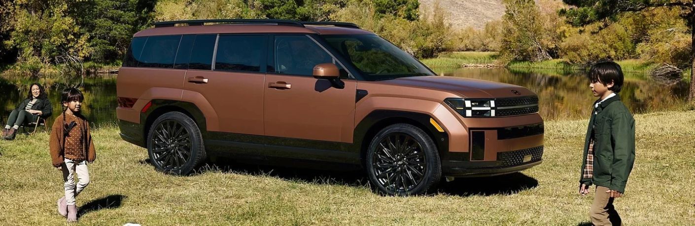 2027 Hyundai Santa Fe parked in a field