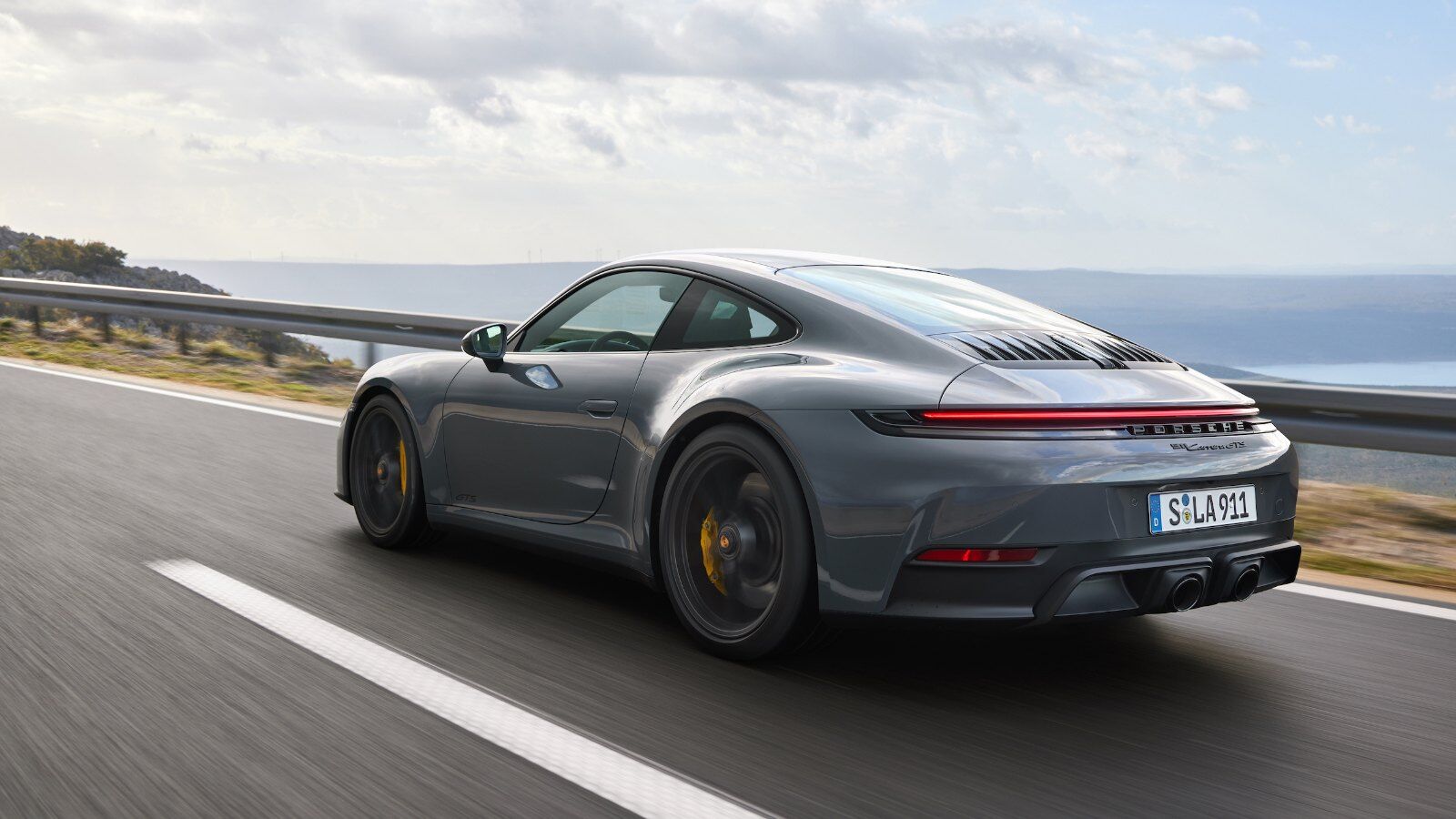 Porsche 911 Carrera GTS driving with PASM in Sport mode – Champion Porsche Pompano Beach, FL