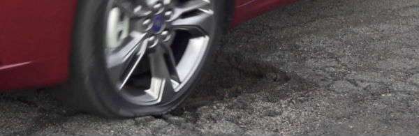 Wheel Hitting Pothole