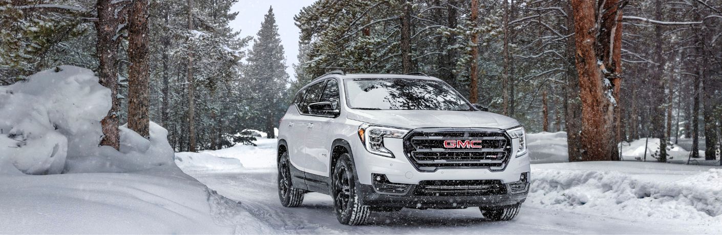 front view of a 2022 GMC model in snow