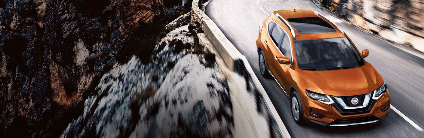 2020 Nissan Rogue driving on a mountain road