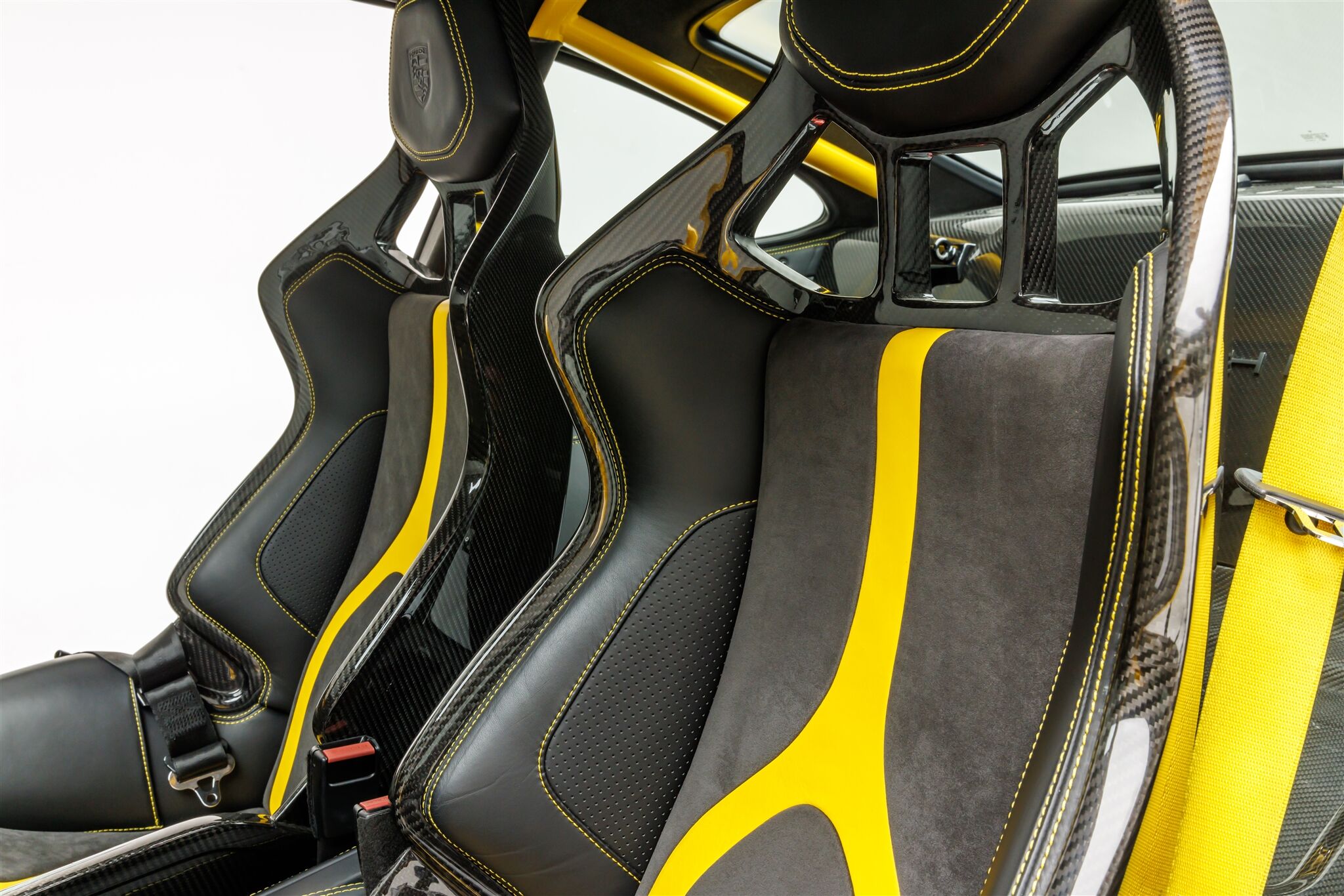 seating of a Porsche Coupe model with yellow accents