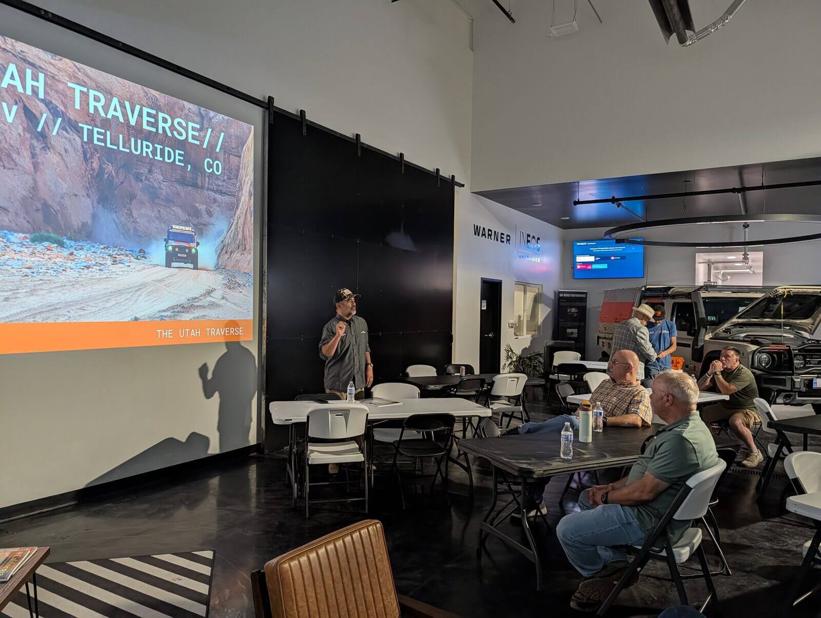 Photographer Sinuhe Xavier presenting the Utah Traverse route to Grenadier owners at Warner INEOS Grenadier