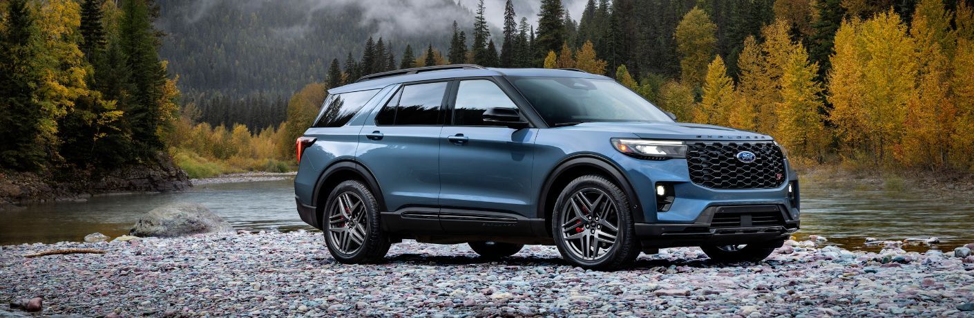 2025 Ford Explorer ST by a river on rocks