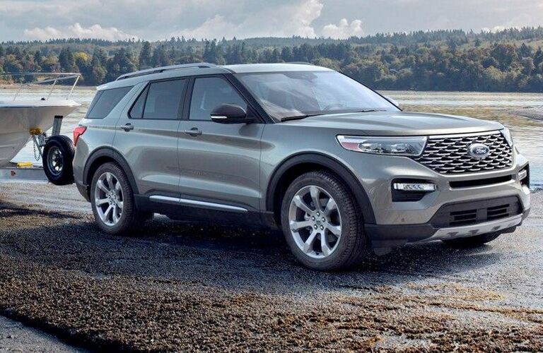 Front view of 2020 Ford Explorer Limited driving on gravel road