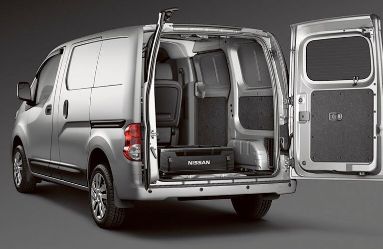 Open rear cargo hatch of a 2017 Nissan NV200 compact cargo van.