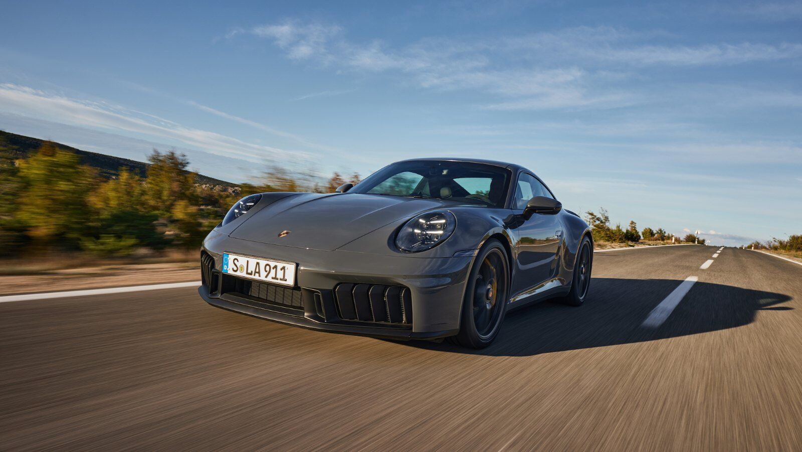 Porsche 911 Carrera GTS driving on a mountain road – PASM at Champion Porsche Pompano Beach, FL