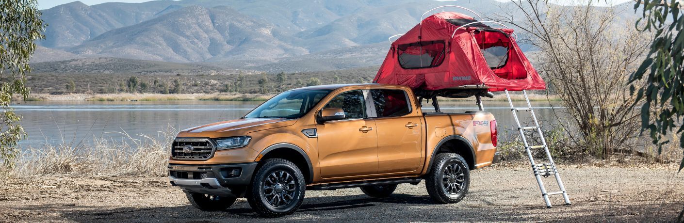 One orange color 2019 Ford Ranger with a roof tent