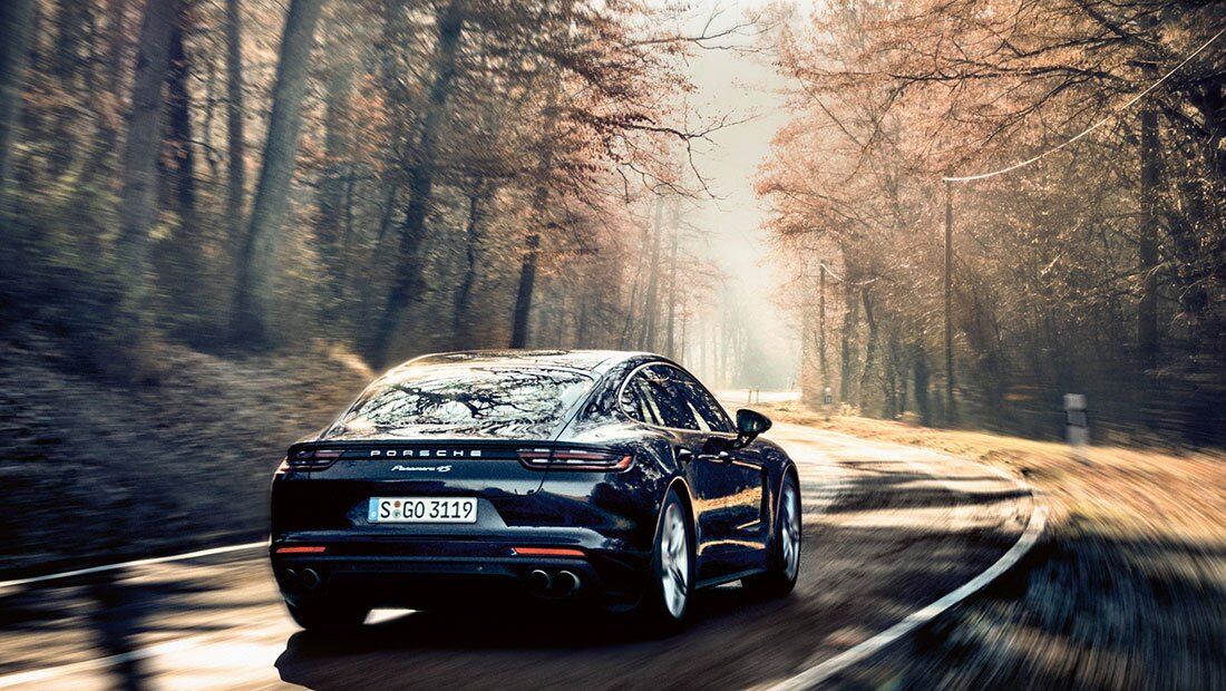 Porsche Panamera 4S with InnoDrive driving on a country road
