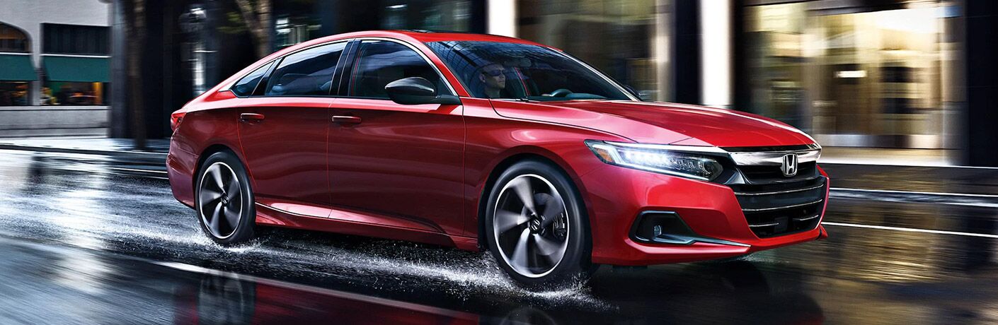 Red 2021 Honda Accord on Wet City Street