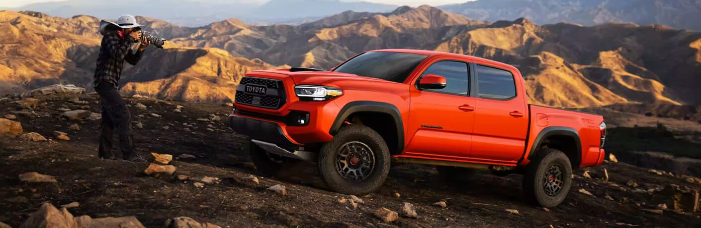 A photographer clicking the 2023 Toyota Tacoma
