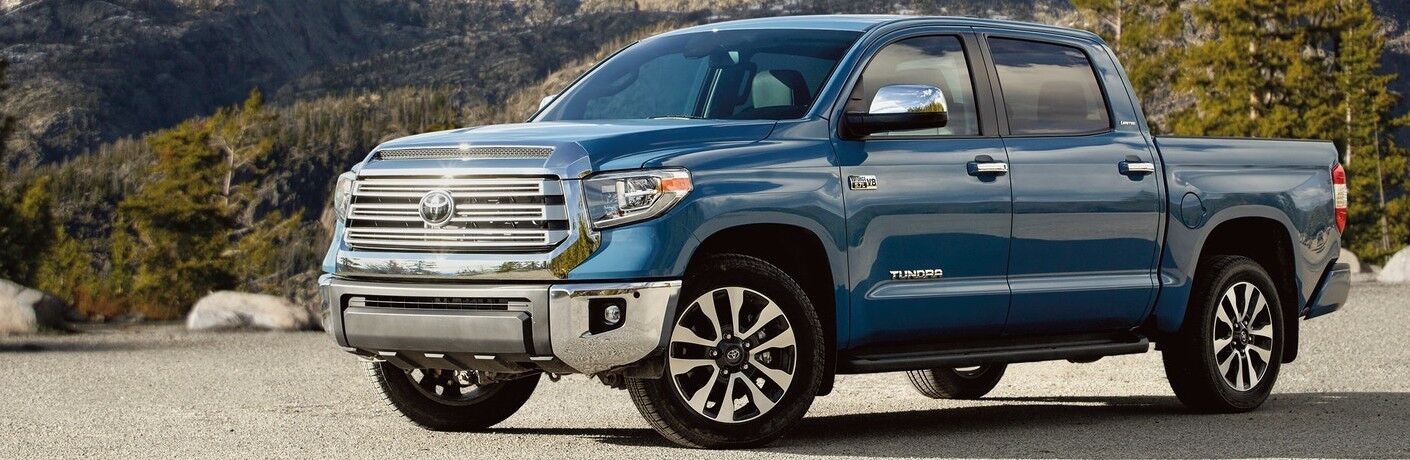 Blue 2021 Toyota Tundra with a forest in the background