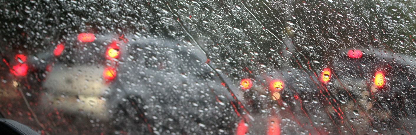 Vehicle windshield with rain drops