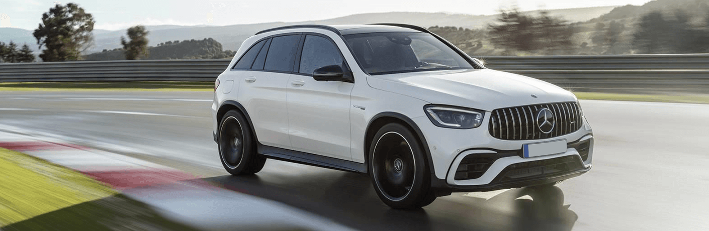 2022 Mercedes-AMG® GLC white side view on track