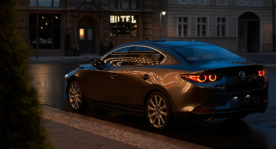 2023 Mazda3 Hatchback driving down the road