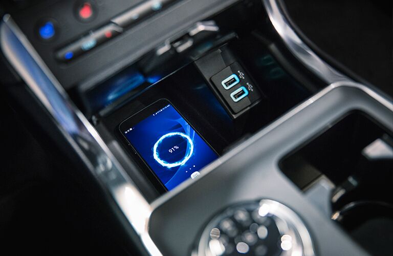 Smartphone charging wirelessly inside 2019 Ford Edge