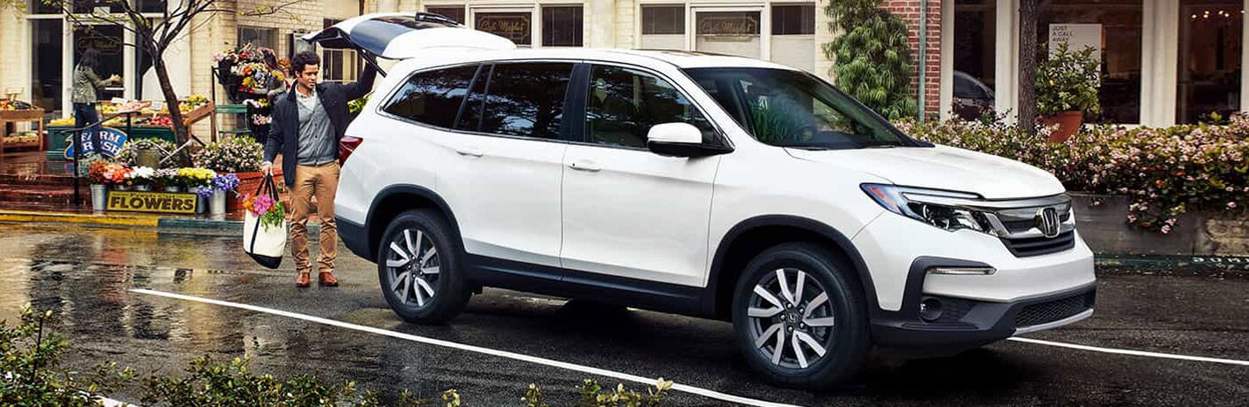2021 Honda Pilot side view with a man