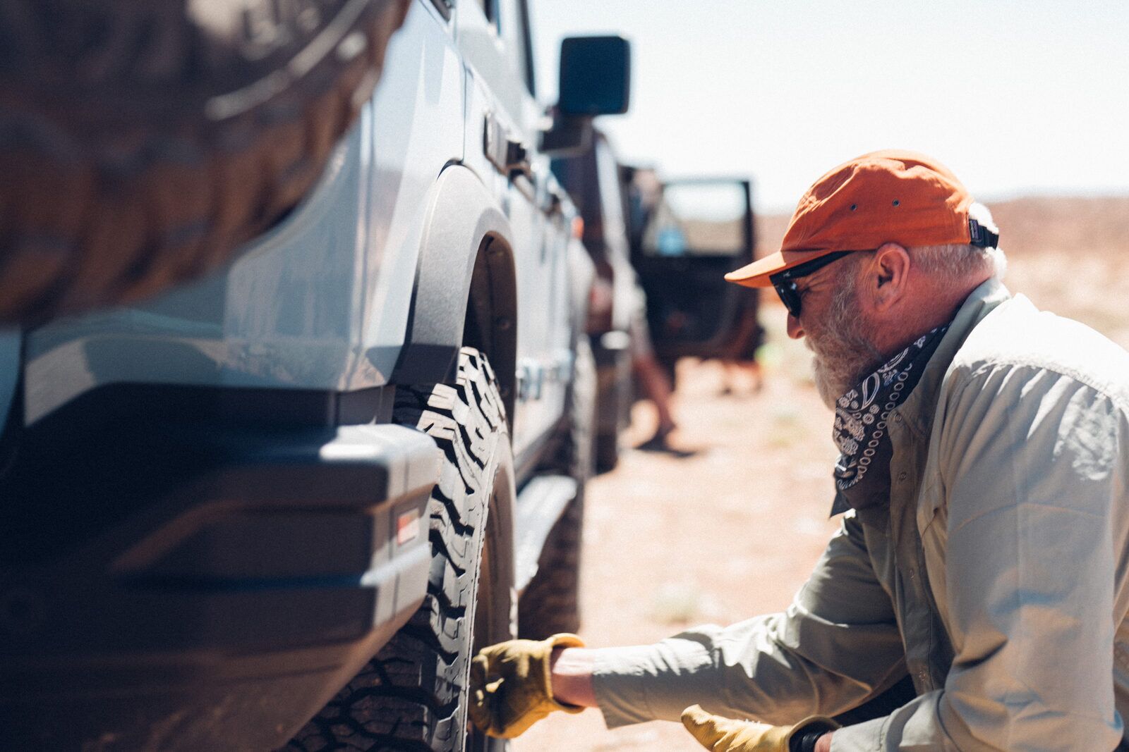 INEOS Grenadiers airing down tires on a backcountry trail during the Utah Traverse with Storyteller Overland