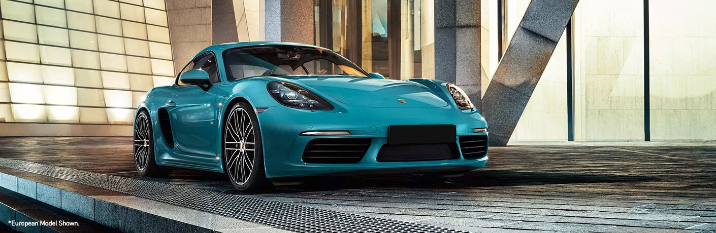 blue 2020 Porsche 718 Cayman parked near building