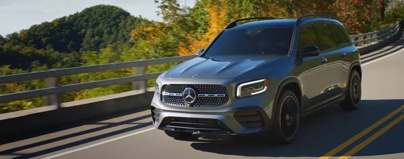 Grey 2020 Mercedes-Benz GLB driving on a winding highway