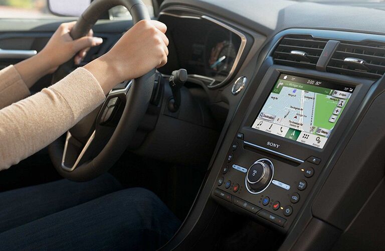 Hands gripping 2019 Ford Fusion steering wheel