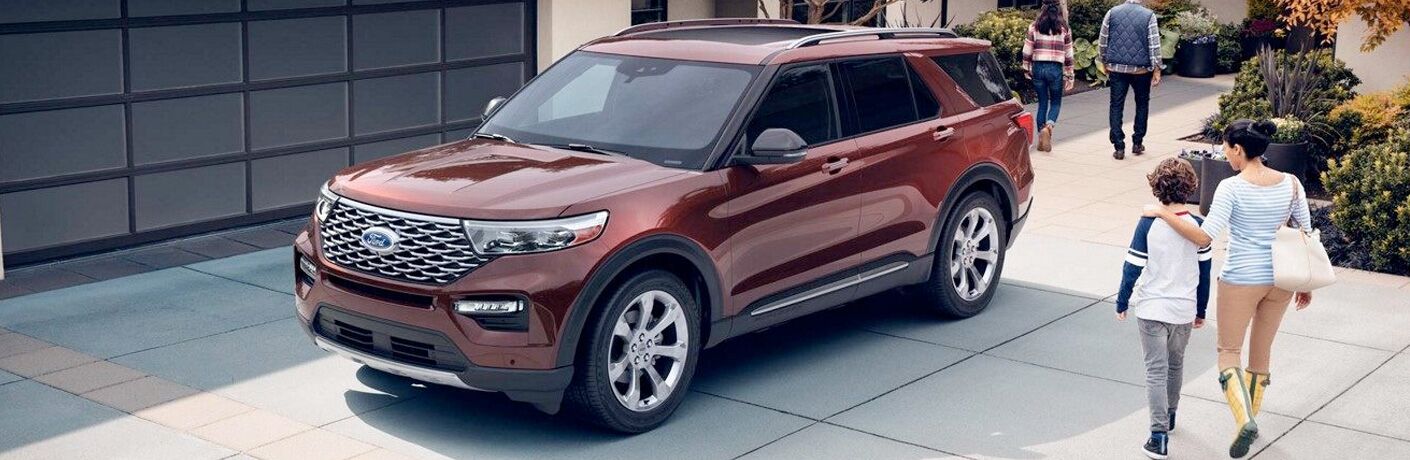Front view of red 2020 Ford Explorer Limited in driveway